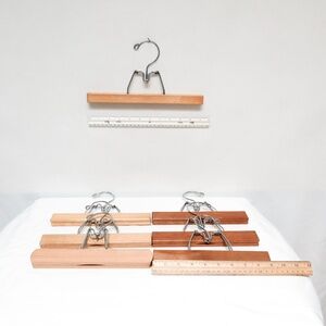 Lightly used batch of 7 wooden clothes hangers for pants and skirts
